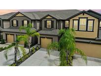 Two-story townhouses with attached garages and landscaping at 11826 Sky Acres Ter, Bradenton, FL 34211