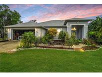 One-story house with a landscaped yard at 289 Dandelion Ct, Spring Hill, FL 34606