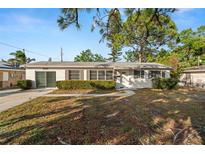 Ranch-style home with a well-maintained lawn and driveway at 2145 68Th S Ave, St Petersburg, FL 33712