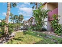 Exterior view of condo building and landscaping at 3841 S Lake Dr # 200, Tampa, FL 33614