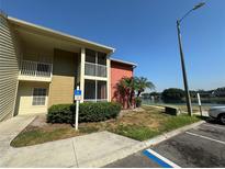 Two-story building with screened balconies and lake view at 314 Lake Parsons Grn # 104, Brandon, FL 33511