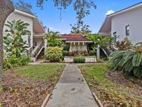 Attractive building exterior with landscaping and walkway at 300 S Florida Ave # 500C, Tarpon Springs, FL 34689