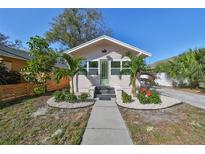 Charming bungalow with landscaped yard, walkway, and updated exterior at 440 22Nd N St, St Petersburg, FL 33713