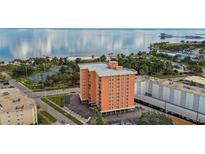 Aerial view of a waterfront building with tennis courts nearby at 1120 N Shore Ne Dr # 703, St Petersburg, FL 33701