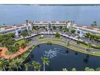 Aerial view of waterfront community with pond and lush landscaping at 5153 Isla Key S Blvd # 412, St Petersburg, FL 33715