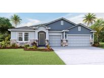 One-story home with gray siding, stone accents, and two-car garage at 4311 Pullet Ct, Lakewood Ranch, FL 34211