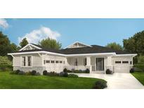 Charming single Gathering home boasts a two-car garage, landscaped lawn, and stylish architectural design at 4729 Majestic Hills Loop, Brooksville, FL 34601