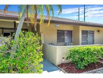 Ground floor condo unit with private patio and landscaping at 1308 13Th Se Cir, Largo, FL 33771