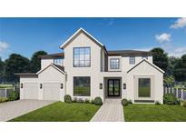Stunning new two-story home with a three car garage, manicured lawn, and a charming stone walkway at 3403 W Leona St, Tampa, FL 33629