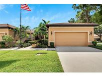 Single-Gathering home with a two-car garage and manicured lawn at 242 Shell Falls Dr, Apollo Beach, FL 33572