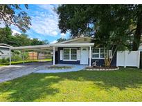Charming one-story home with carport and landscaped lawn at 10007 N 22Nd St, Tampa, FL 33612