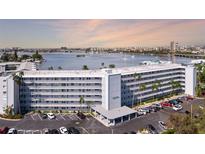 Aerial view of a waterfront building with parking at 1868 Shore S Dr # 207, South Pasadena, FL 33707
