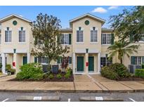 Front view of two story townhouses with landscaping at 214 Cape Harbour Loop # 105, Bradenton, FL 34212