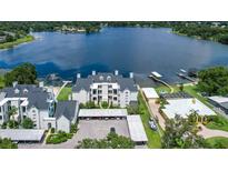 Stunning waterfront condo complex with lush landscaping and covered parking near a beautiful lake at 3127 W Sligh Ave # 204B, Tampa, FL 33614