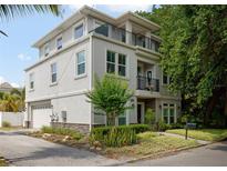Three-story home with stone accents and a balcony at 1408 W Azeele St, Tampa, FL 33606