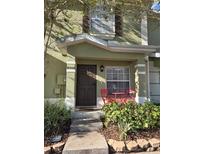 Inviting front entrance with red chairs at 8504 Brushleaf Way, Tampa, FL 33647