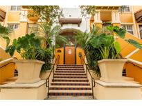 Building exterior with tiled steps and lush landscaping at 100 4Th S Ave # 205, St Petersburg, FL 33701