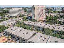 Aerial view of condo community near office buildings and highway at 4611 W Fig St # 209, Tampa, FL 33609