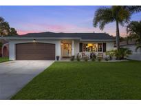 Charming single-story home with a two-car garage and manicured lawn at 3462 Bayshore Ne Blvd, St Petersburg, FL 33703