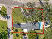 Aerial view of the property showcasing the house, pool, and yard at 5301 Venetian Ne Blvd, St Petersburg, FL 33703