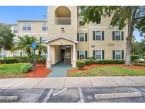 Charming condominium exterior with landscaped grounds, convenient parking, and inviting entrance at 18593 Bridle Club Dr, Tampa, FL 33647