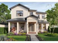 Two-story farmhouse style home with a landscaped front yard at 2701 13Th N St, St Petersburg, FL 33704