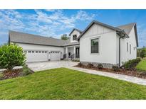 Charming craftsman style home with a 3-car garage at 4068 Southern Valley Loop, Brooksville, FL 34601