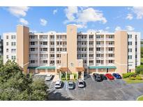 Three-story building with parking and landscaping at 6450 Shoreline Dr # 9105, St Petersburg, FL 33708