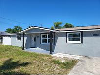 Newly renovated ranch home with gray exterior at 12800 Vassar Ct, Hudson, FL 34667