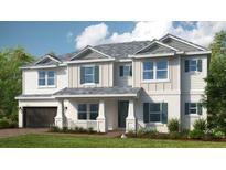 Two-story house with gray roof, white siding, and green shutters at 16285 Alpha Grove Pl, Odessa, FL 33556