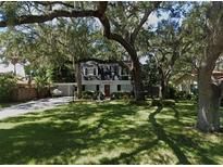 Charming two-story house with a spacious lawn and mature trees at 205 S Occident St, Tampa, FL 33609