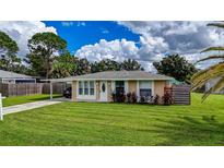 Charming ranch home with landscaped yard and carport at 307 Southland Rd, Venice, FL 34293