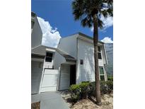 White condo exterior with palm tree at 724 Haven Pl, Tarpon Springs, FL 34689