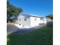 Updated exterior of a single-Gathering home with landscaping at 3751 67Th N Ave, Pinellas Park, FL 33781