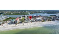Aerial view of beachfront property, showcasing its location and proximity to the ocean at 19718 Gulf Blvd, Indian Shores, FL 33785