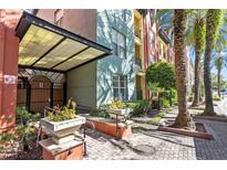 Attractive building exterior with palm trees and a welcoming entrance at 2411 W Horatio St # 522, Tampa, FL 33609