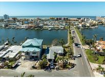 Aerial view of waterfront property and neighborhood at 11480 4Th E St, Treasure Island, FL 33706