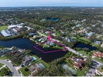 Aerial view of waterfront home on a private lot at 1721 St Pauls Dr, Clearwater, FL 33764