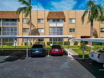 Covered parking area with assigned spaces for residents at 1540 Glen Oaks E Dr # B134, Sarasota, FL 34232