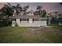 Cozy one-story house with a well-maintained lawn at 132 Dartmouth W Ave, Oldsmar, FL 34677