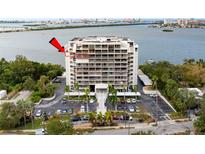 Aerial view of a condo building near the water, highlighting its location at 500 N Osceola Ave # 802, Clearwater, FL 33755