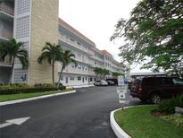 Exterior view of an apartment building with parking at 3128 59Th S St # 209, Gulfport, FL 33707