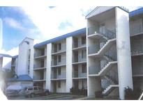Three-story apartment building with exterior stairs and parking at 2424 W Tampa Bay Blvd # 208, Tampa, FL 33607