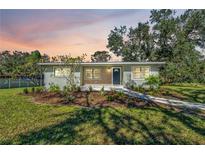 Newly renovated home with a modern facade and landscaped front yard at 12020 82Nd E St, Parrish, FL 34219