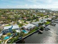 Aerial view of waterfront property with pool and dock at 1301 Sea Gull S Dr, St Petersburg, FL 33707