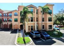 Luxury condo building with palm trees and ample parking at 2717 Via Cipriani # 622B, Clearwater, FL 33764