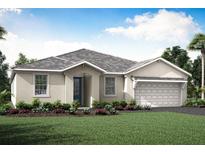 One-story home with light beige exterior, dark blue door, and two-car garage at 18440 Vista Park Ter, Venice, FL 34293