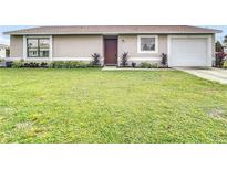 Charming single story home with well-maintained lawn at 7518 Lyncrest St, North Port, FL 34287