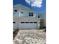Charming two-story home with brick paver driveway and attached two car garage at 31901 Anchor Point Dr, Wesley Chapel, FL 33545