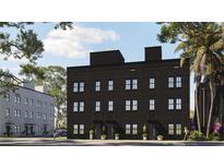 Modern three-story townhomes with dark brick exterior at 1302 E Kay St # 1, Tampa, FL 33602